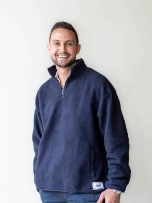 Jodi Lee Bowel Cancer Foundation Ambassador Hugo Toovey in the JLF x ORTC Sherpa Jumper