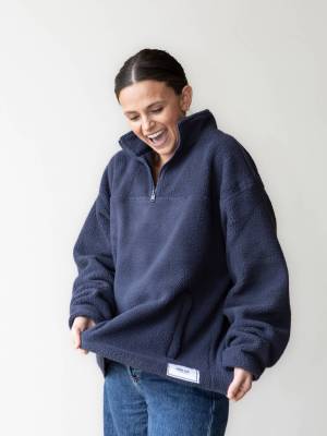 Jodi Lee Bowel Cancer Foundation Ambassador Kellie Finlayson wearing the Women's JLF x ORTC Sherpa Jumper